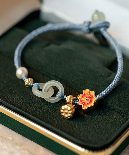 Pulsera de plata de ley azul dorada con dije de perla de jade tejida a mano