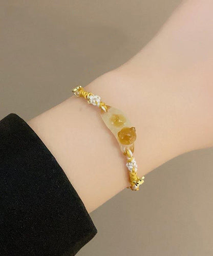 Pulsera con dijes de estrellas y gatos de Osmanthus azul tejida a mano