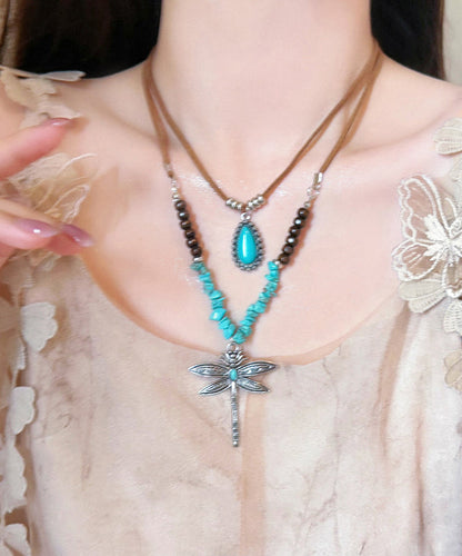 Handgefertigte Halskette mit doppellagigem Anhänger aus brauner Legierung und türkisfarbenem Libellenperlen-Emblem