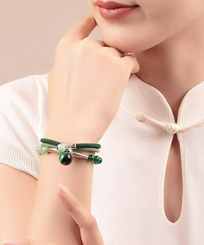 Handgefertigtes Charm-Armband aus grünem Sterlingsilber mit Jade-Achat und Katzenauge