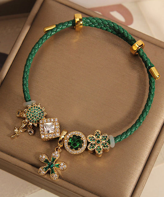 Pulsera hecha a mano con dije de girasol y gemas incrustadas de circonitas en plata de ley verde dorada