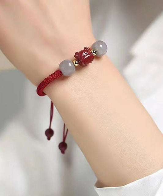 Pulsera con borlas de jade cinabrio gris hecha a mano