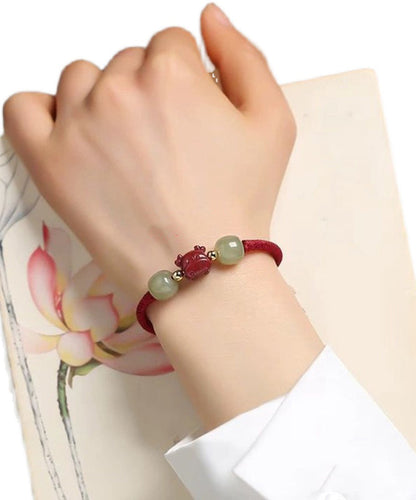 Pulsera con borlas de jade cinabrio gris hecha a mano