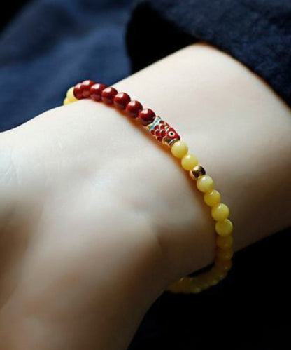 Handgefertigtes Cinnaba-Armband mit eingelegtem Kristall