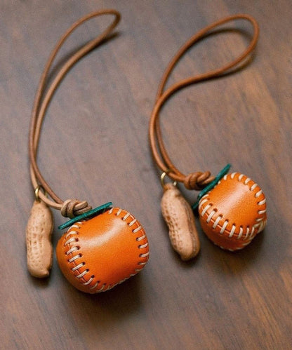 Handgefertigte Handyketten aus orangefarbenem Flechtwerk mit Kaki- und Erdnussmotiven