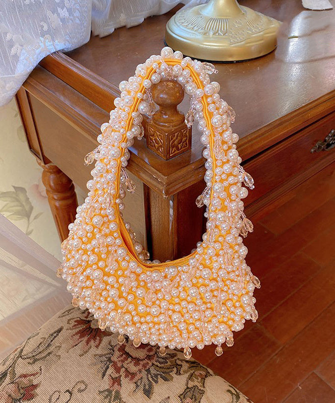 Handgefertigte rosa Tragetasche aus gewebten Perlen