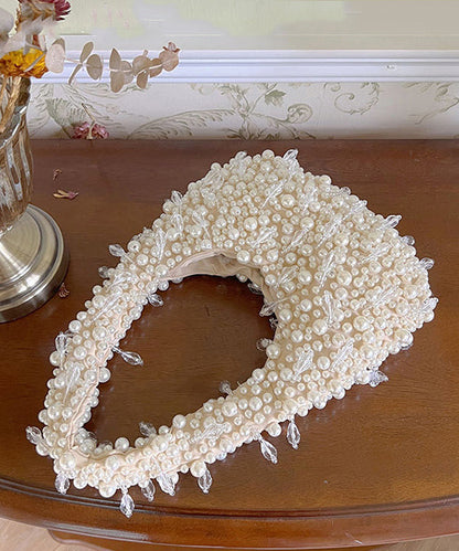 Handgefertigte rosa Tragetasche aus gewebten Perlen