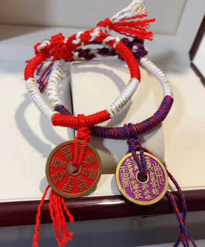 Pulsera tejida a mano con borlas moradas