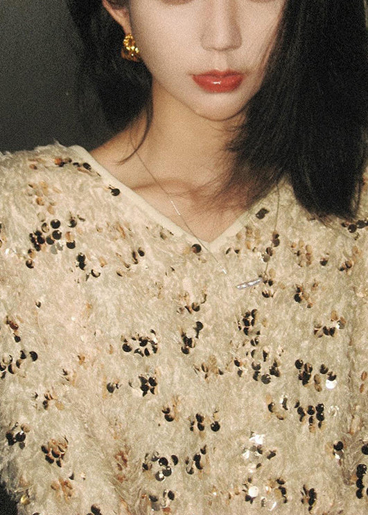 Suéteres de punto con lentejuelas y borlas con cuello en V hechos a mano para invierno