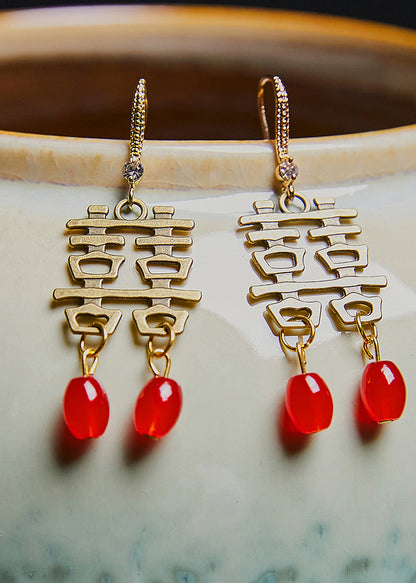 Pendientes colgantes de boda de cobre con el personaje XI hechos a mano