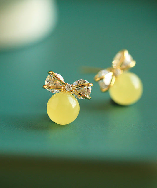 Pendientes colgantes de plata de ley amarilla con circonitas doradas y lazo de cera de abeja hechos a mano