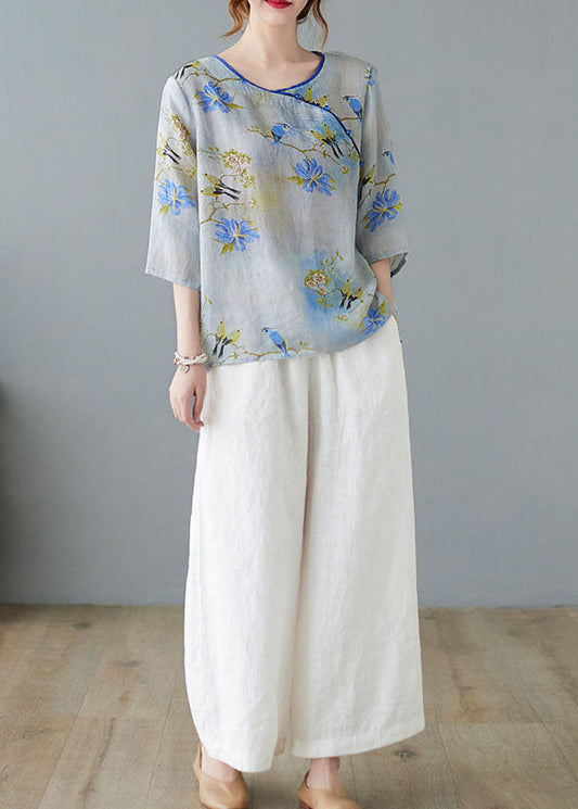 Hellblaue Blusen mit Knopfdruck und halben Ärmeln