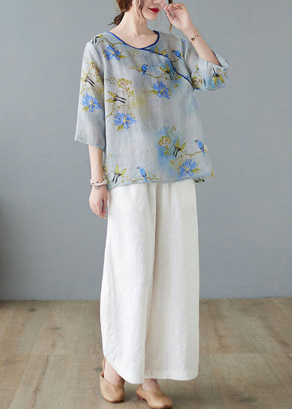 Hellblaue Blusen mit Knopfdruck und halben Ärmeln