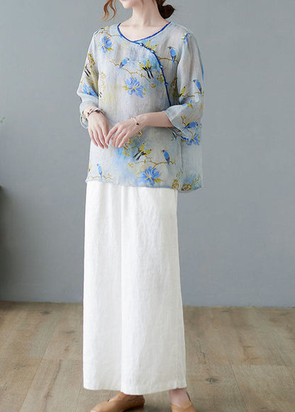 Hellblaue Blusen mit Knopfdruck und halben Ärmeln