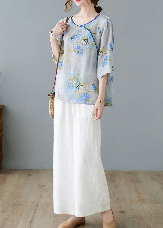 Hellblaue Blusen mit Knopfdruck und halben Ärmeln