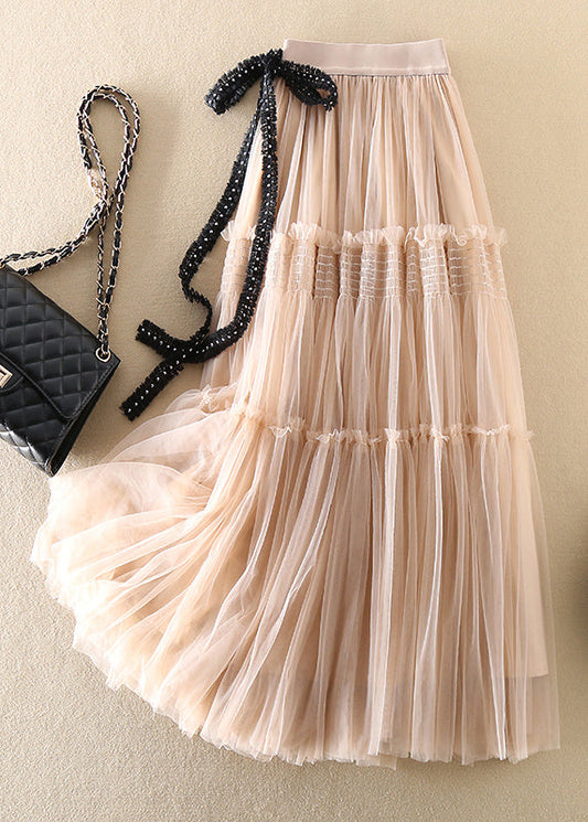 Lockerer beigefarbener Tüllrock mit Schleife und Falten