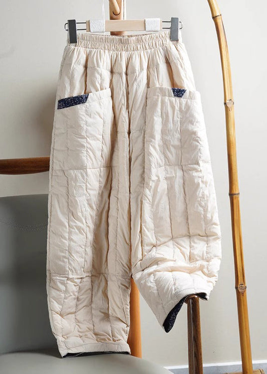 Pantalones holgados de algodón con cintura elástica y bolsillos beige para invierno