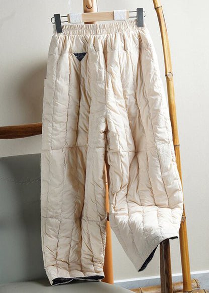 Pantalones holgados de algodón con cintura elástica y bolsillos beige para invierno