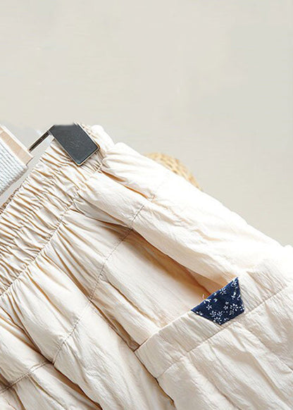 Pantalones holgados de algodón con cintura elástica y bolsillos beige para invierno