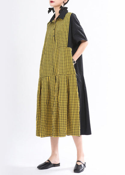 Lockeres schwarzes kariertes Patchwork-Knopf-Herbstkleid mit halben Ärmeln