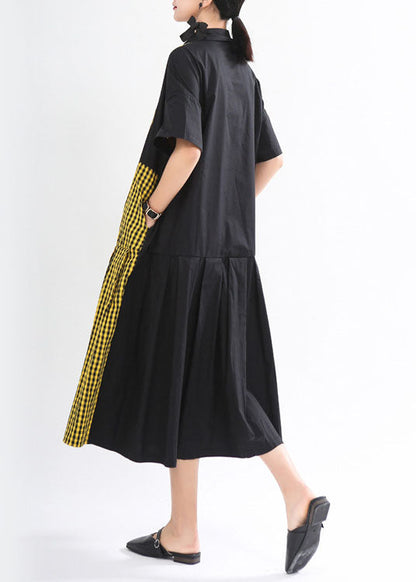 Lockeres schwarzes kariertes Patchwork-Knopf-Herbstkleid mit halben Ärmeln