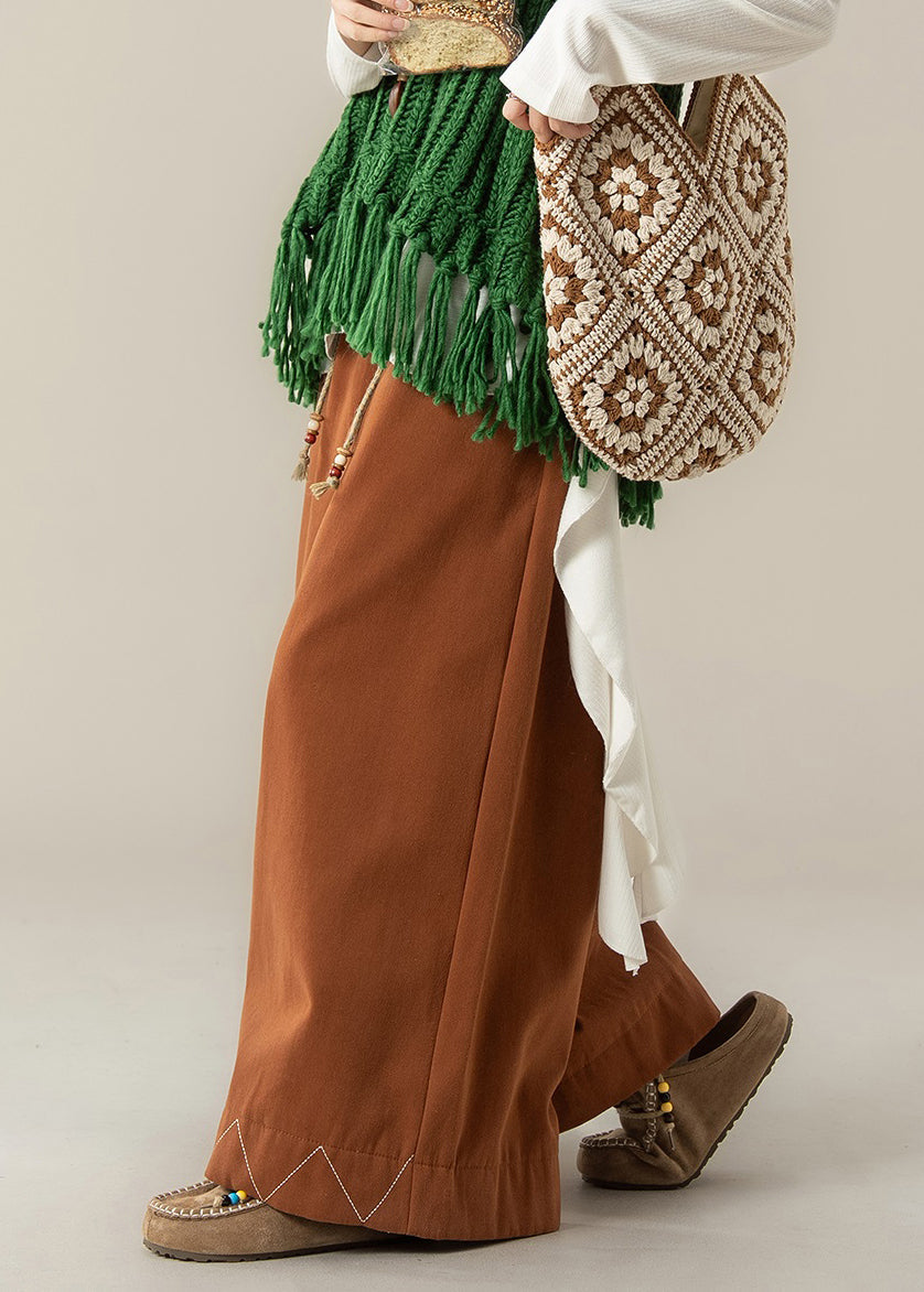 Weit geschnittene, orangefarbene Baumwollhose mit Kordelzug und weitem Bein für den Frühling