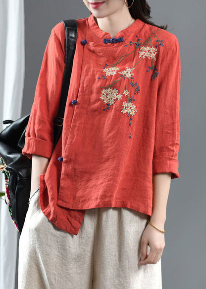 Lockeres, orangefarbenes, besticktes Leinenoberteil mit Blumenmuster und halblangen Ärmeln