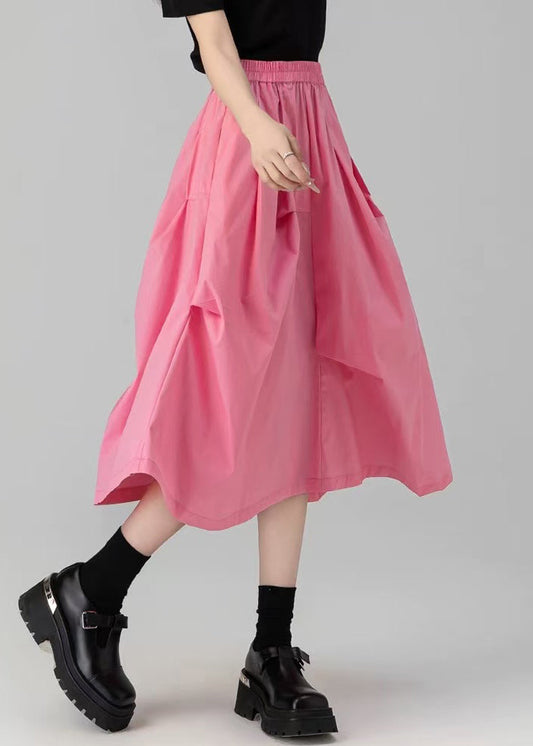 Lockerer, rosafarbener Rock aus einfarbiger Baumwolle mit Falten und Taschen für den Sommer