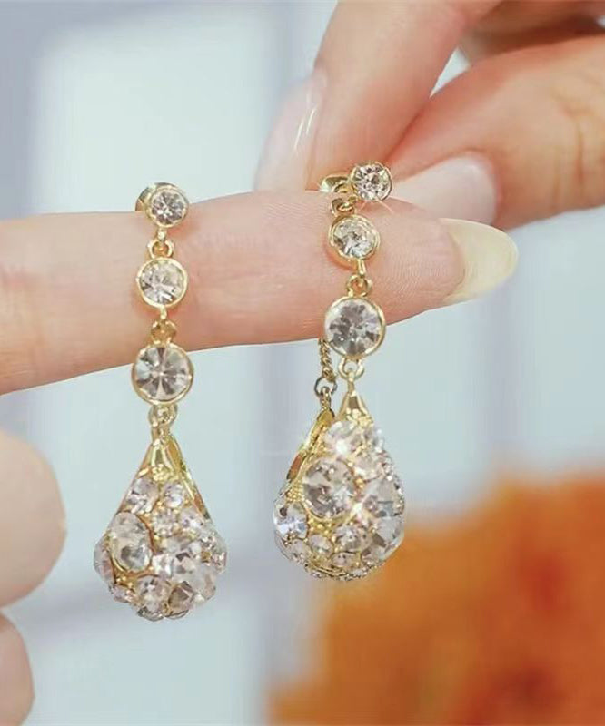 Pendientes de aro modernos con circonitas doradas y cobre