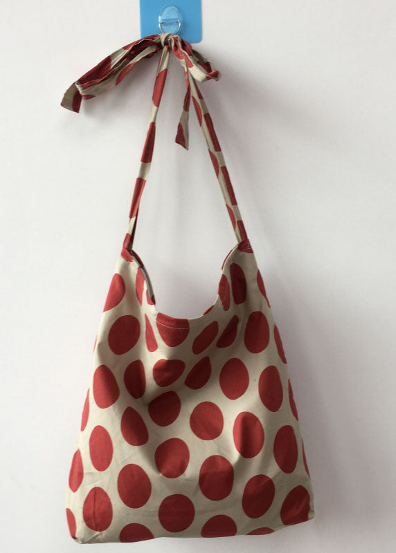 Moderne Messenger Bag aus Canvas mit orangefarbenem Punktmuster