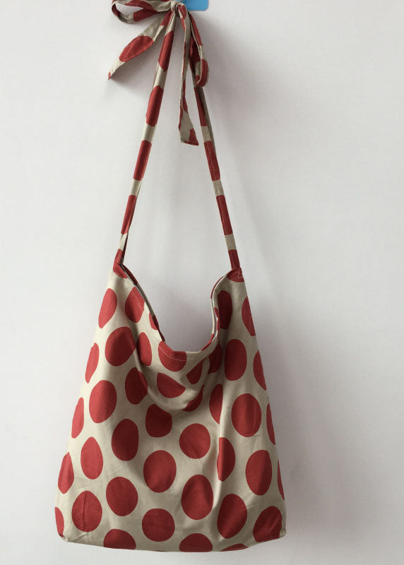 Moderne Messenger Bag aus Canvas mit orangefarbenem Punktmuster