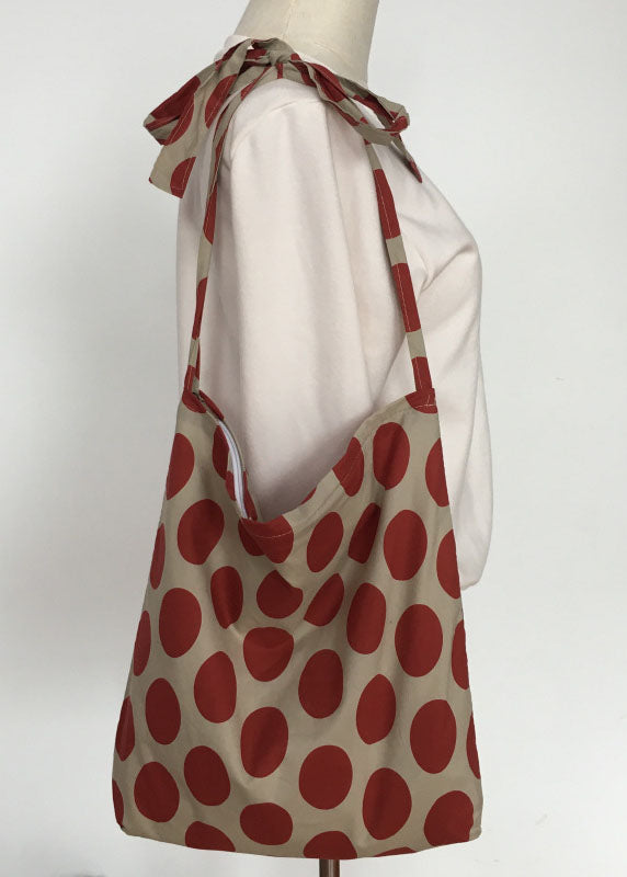 Moderne Messenger Bag aus Canvas mit orangefarbenem Punktmuster