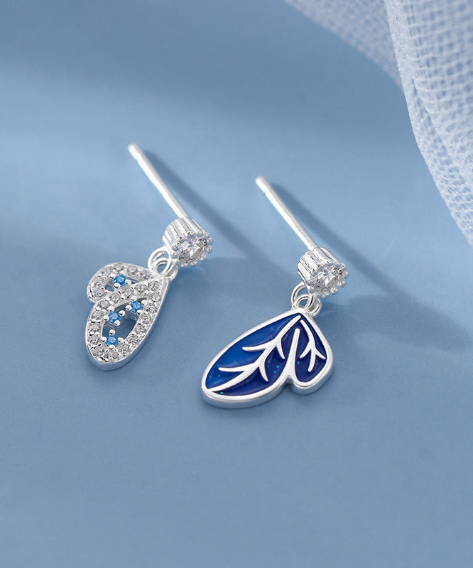 Pendientes de mariposa asimétricos con circonitas y seda moderna en plata de ley