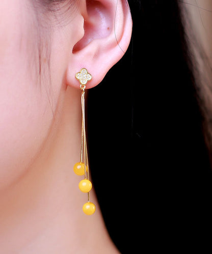 Moderne Tropfenohrringe aus gelbem Sterlingsilber mit eingelegtem Bernstein und Bienenwachs