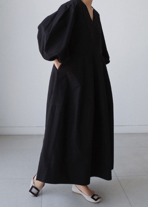 Naturschwarzes Partykleid aus Baumwolle mit V-Ausschnitt und Laternenärmeln