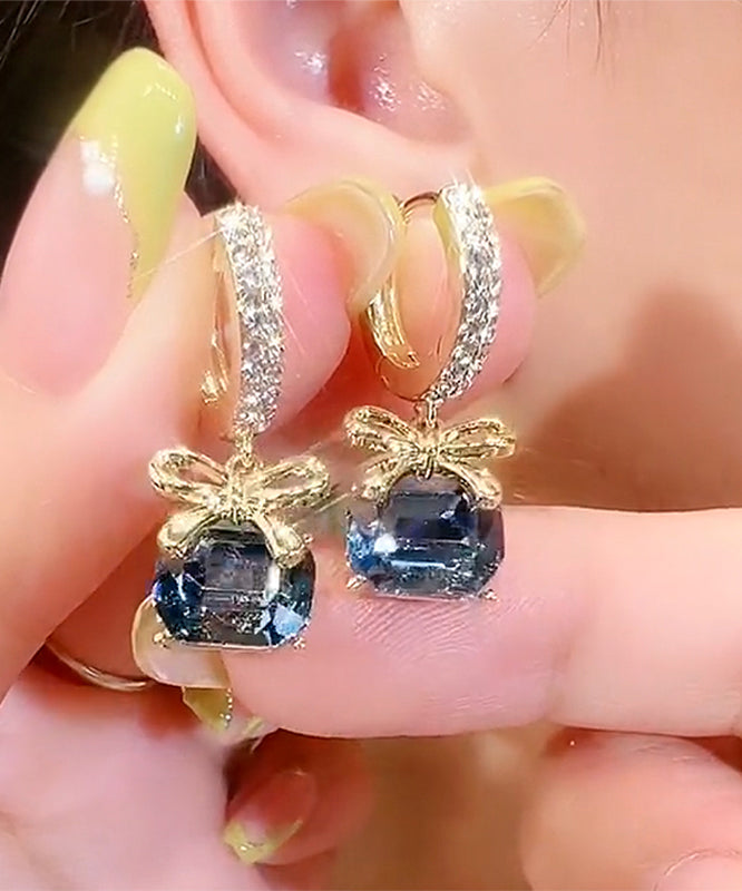 Nuevos pendientes de aro con lazo de cristal y circonitas doradas y cobre