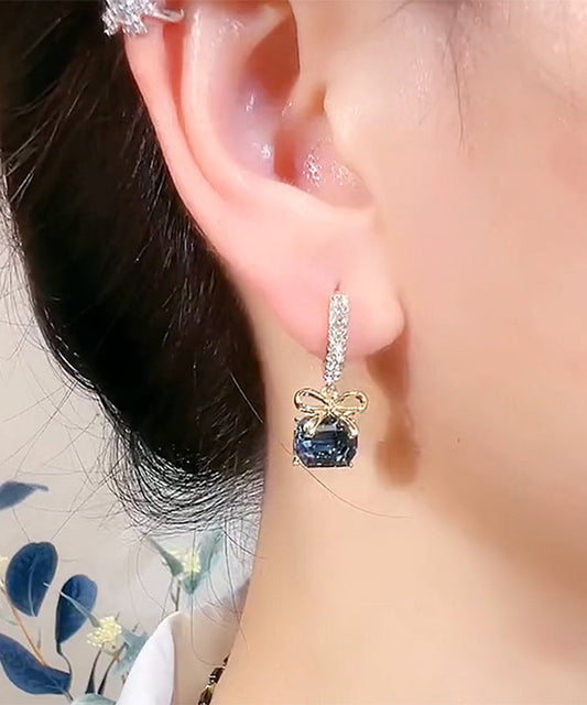 Nuevos pendientes de aro con lazo de cristal y circonitas doradas y cobre