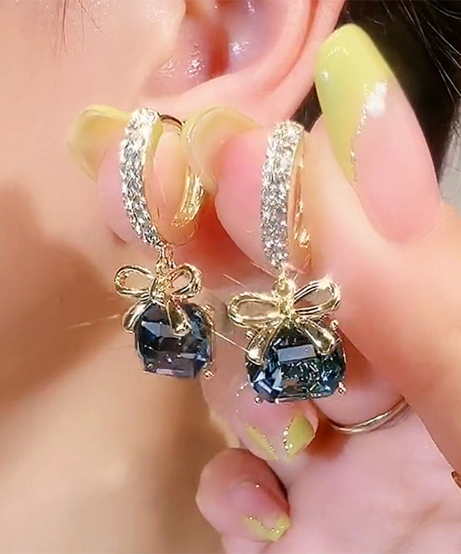 Nuevos pendientes de aro con lazo de cristal y circonitas doradas y cobre