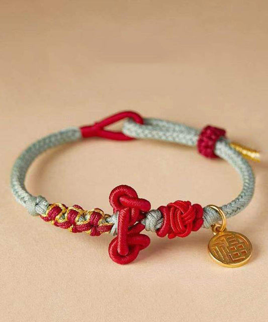 Nueva pulsera con dijes de la marca Fu tejida a mano en color verde claro