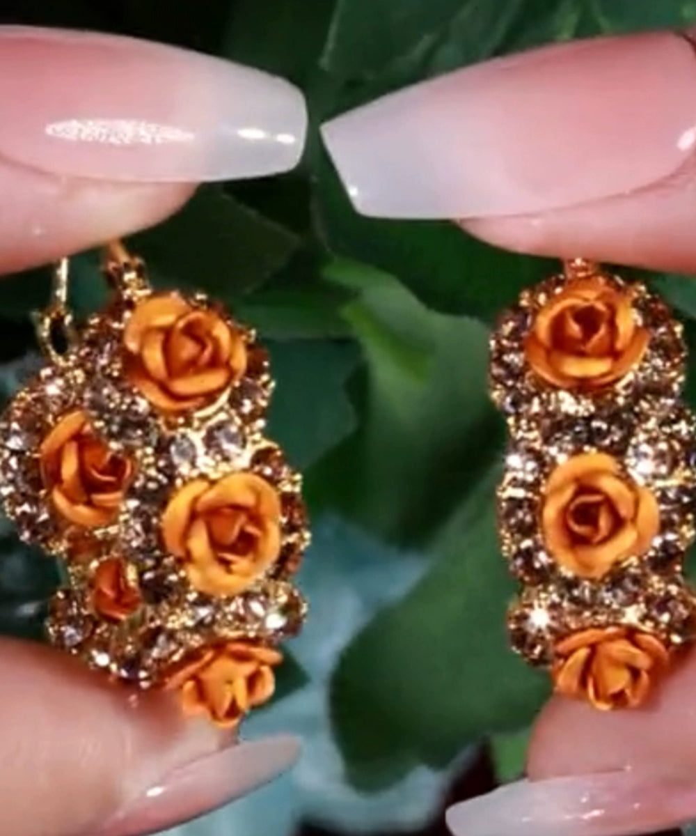 Pendientes de aro con circonitas rosas y aleación de oro champán novedosos