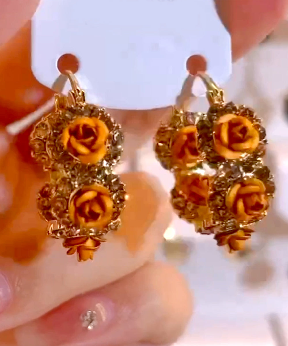 Pendientes de aro con circonitas rosas y aleación de oro champán novedosos