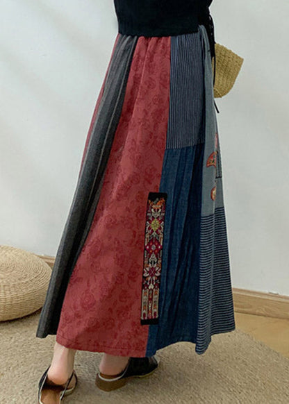 Neuartiger marineblauer Patchwork-Maxirock mit bestickter Blumenquaste und hoher Taille