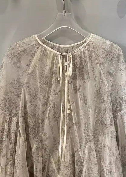 Blusa de encaje con lazo y mangas farol con estampado de albaricoque orgánico