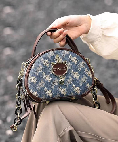 Bolso redondo de piel sintética con estampado azul orgánico