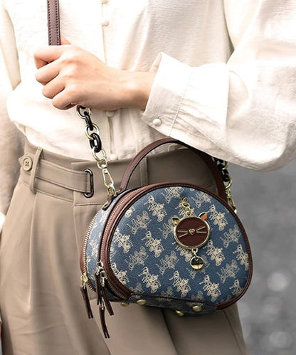 Bolso redondo de piel sintética con estampado azul orgánico