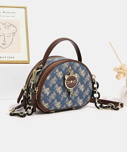 Bolso redondo de piel sintética con estampado azul orgánico