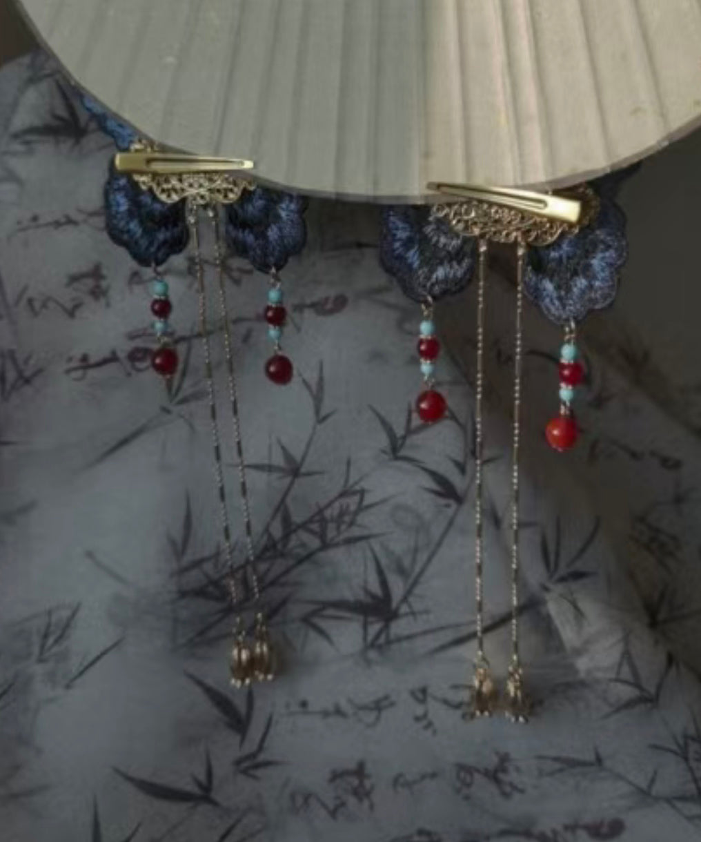 Horquilla con borla de mariposa bordada con sobredorado en plata de ley azul de diseño original