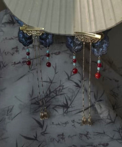 Horquilla con borla de mariposa bordada con sobredorado en plata de ley azul de diseño original