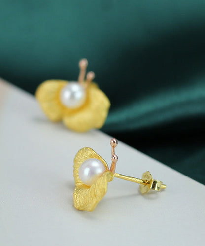 Pendientes de mariposa con perla y diseño original de cobre dorado