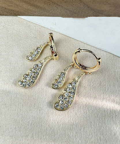 Pendientes de aro con diseño original de acero inoxidable dorado y circonitas en forma de gota de agua.